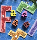 Jeu de plateau avec tuiles colorées numérotées et pions personnages