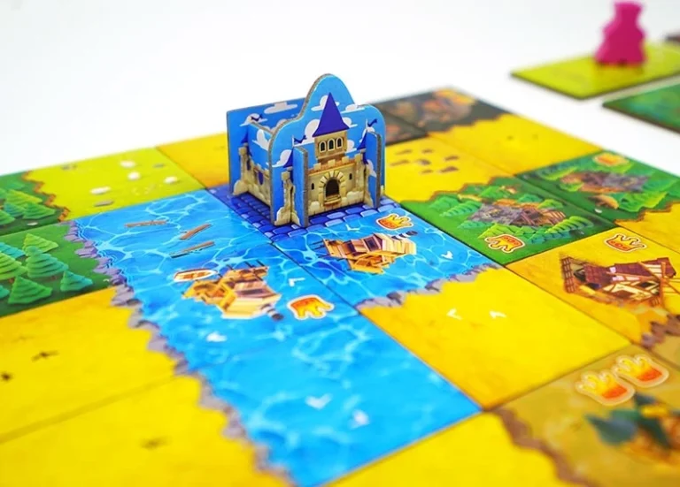 Jeu de société pop-up avec château bleu et plateau coloré